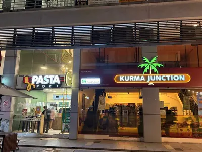 a store front of a store with a palm tree on it at THE CEO 3 BEDROOM near USM SPICE ARENA PANTAI SPECIALIST AIRPORT in Bayan Lepas