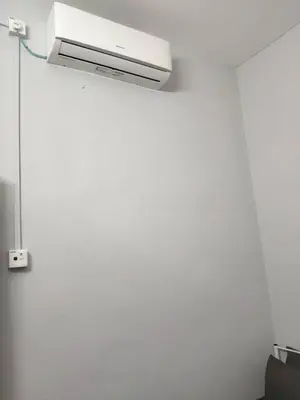 a room with a air conditioner on a wall at Pa&Ma HomeStay Kulim III 3R2B FullyAircond in Gua Sai