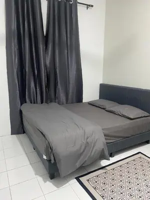 a bed with a black curtain in a room at AISY Homestay MERAPOH in Pulai