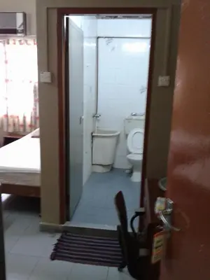 a bathroom with a shower and a toilet in a room at HotelMalaya in Taiping