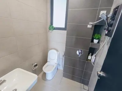 a bathroom with a toilet and a sink at Infinity Pool, Urban Suites, Georgetown, 2 Car Parks by Star Home in George Town