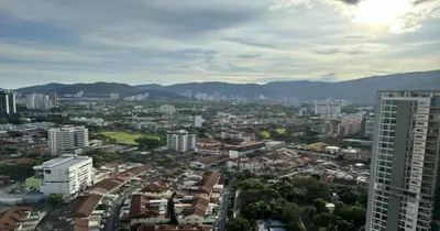 an aerial view of a city with buildings and mountains at 218 Macalister Food Paradise By Smart Space Home in George Town
