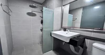 a bathroom with a sink and a mirror and a toilet at 218 Macalister Food Paradise By Smart Space Home in George Town