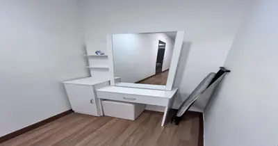 a white dressing table with a mirror on a wall at 218 Macalister Food Paradise By Smart Space Home in George Town