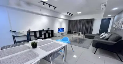 a living room with a couch and a table at 218 Macalister Food Paradise By Smart Space Home in George Town