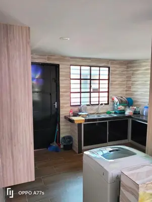 a kitchen with a sink and a counter top at RJ design homestay in Kampong Batu Lapan