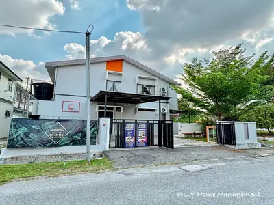 a white building with an open gate on a street at Bercham Landed CornerLot 6BR with Karaoke Set & BBQ in Ipoh