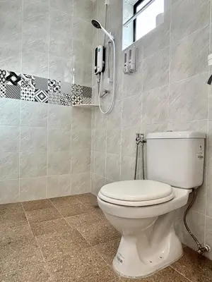 a bathroom with a toilet and a shower at Bercham Landed CornerLot 6BR with Karaoke Set & BBQ in Ipoh