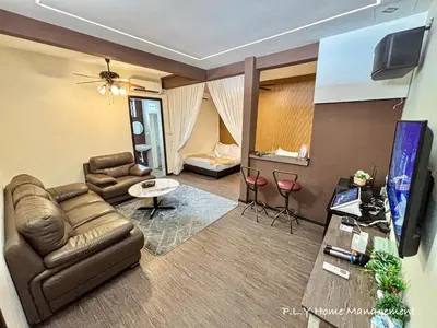 a living room with a couch and a tv and a room at Bercham Landed CornerLot 6BR with Karaoke Set & BBQ in Ipoh