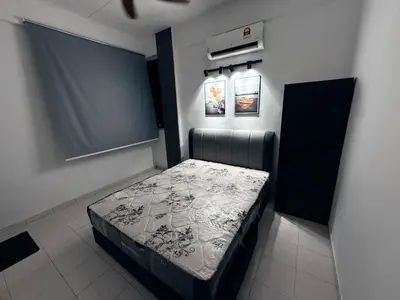 a small bedroom with a bed in a room at Babania Spice Stay in Bayan Lepas