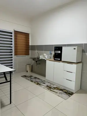 a white kitchen with a sink and a microwave at Sky9Haven Homestay in Ipoh