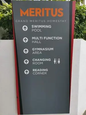 a sign on the side of a building at Meritus in Perai