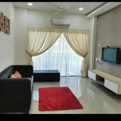 a living room with a couch and a red rug at DhiyaAdraHomestay in Chemor