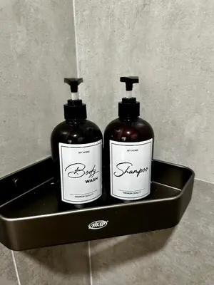 two bottles of soap in a box on a counter at Molek Vacation Home in Gelugor