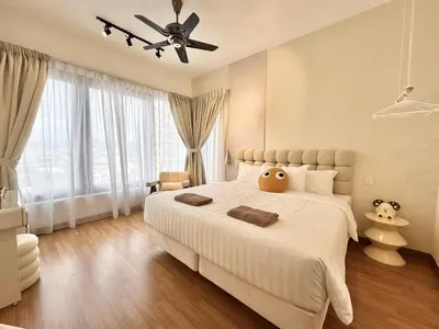 a bedroom with a large white bed with a ceiling fan at Tropicana 218 Macalister #softcreamy #InfinityPool #7pax #3BR2bath #Quality well maintained #Private host in George Town