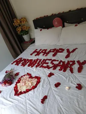 a bed with red roses and hearts on it at Ereens homestay 3 Palas horizon in Cameron Highlands