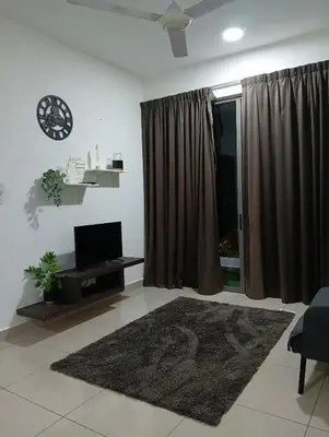 a living room with a television and a rug at Ereens homestay 3 Palas horizon in Cameron Highlands