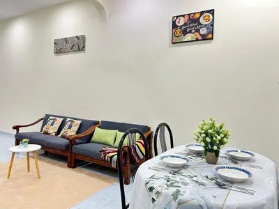 a living room with a couch and a table at S Home Ipoh in Ipoh