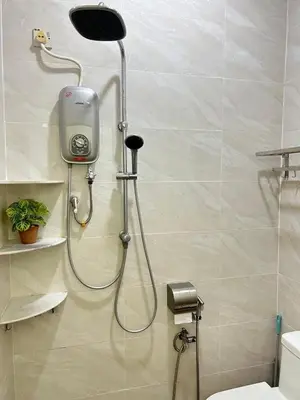 a shower in a bathroom with a shower head at S Home Ipoh in Ipoh