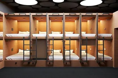 a group of bunk beds in a room at Dynamic capsule in Gua Sai