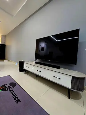 a living room with a large flat screen tv at The Cozy 88 ipoh in Ipoh