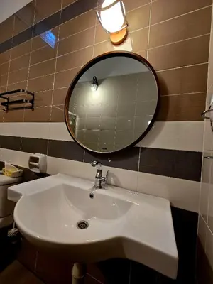 a bathroom with a sink and a mirror at The Cozy 88 ipoh in Ipoh