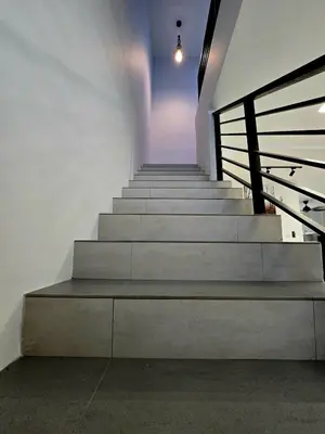 a set of stairs in a building with a stair case at The Cozy 88 ipoh & in Ipoh