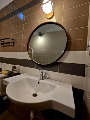 a bathroom with a sink and a mirror at The Cozy 88 ipoh & in Ipoh