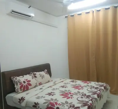 a bedroom with a bed and a window at Small house surrounding with nature in Gua Musang