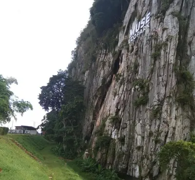 a mountain with a sign on the side of it at Small house surrounding with nature in Gua Musang