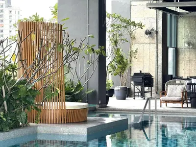 a courtyard with a pool and some plants at Shō Hotel Penang in George Town