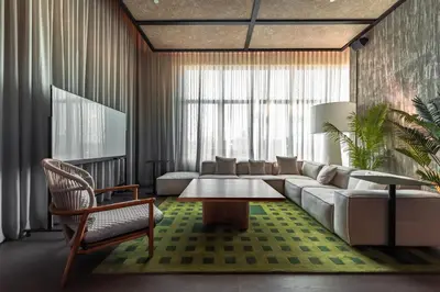 a living room with a couch and a table at Shō Hotel Penang in George Town