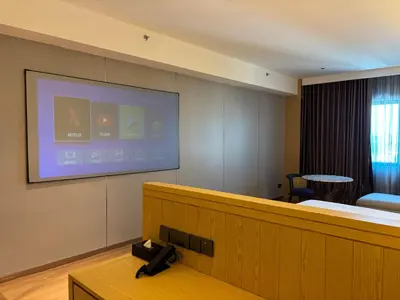 a room with a projection screen on a wall at Shō Hotel Penang in George Town