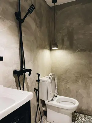 a bathroom with a toilet and a sink at Very Hotel in George Town