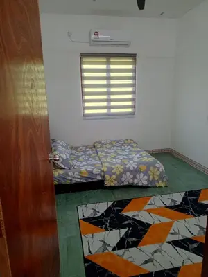 a room with a bed and a window at Dhania Homestay in Gua Sai