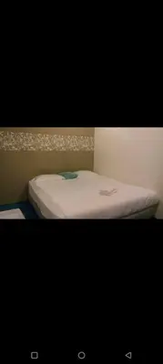 a picture of a bed in a room at Hotel Tropicanna Pulai Point in Ipoh