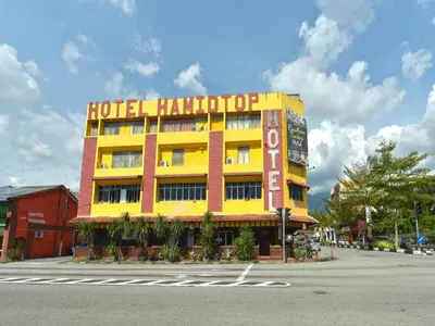 a hotel hilton building on the side of a street at Super OYO Capital O 90659 Raintown Timbers Hotel in Taiping