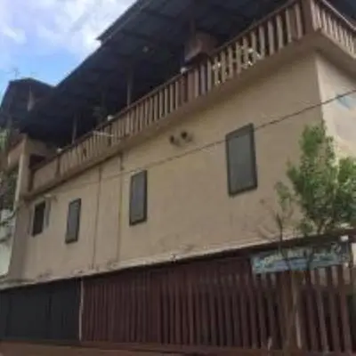a building with a train on top of it at Nipah Bay Villa in Pangkor