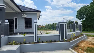 a fence in front of a house at Yash Cottage Taiping Homestay in Taiping