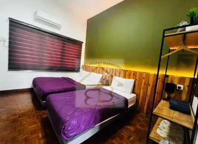 two beds in a room with purple sheets at 188 Private Pool Mansion Ipoh KTV BBQ 30Pax in Ipoh