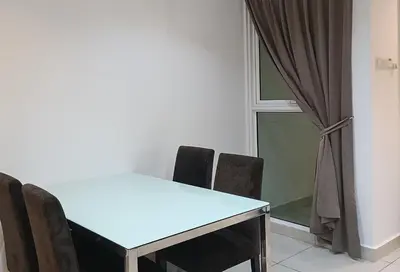 a table and chairs in a room with a window at Gurney Drive Mansion One by RL SUITE in George Town