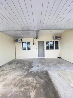 a large garage with a ceiling at Sofea Homestay Tasek Gelugor in Kampong Kubang Menderong
