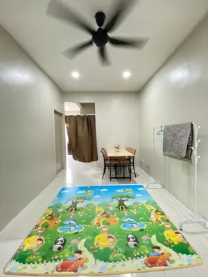 a room with a floor mat with animals on it at Sofea Homestay Tasek Gelugor in Kampong Kubang Menderong