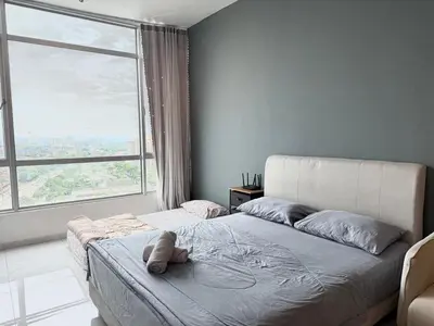 a bedroom with a bed and a large window at Perffect JB view Paradigm UTM in Gua Sai