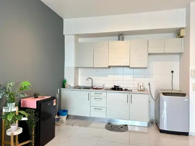 a kitchen with white cabinets and a white refrigerator at Perffect JB view Paradigm UTM in Gua Sai