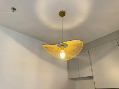 a yellow fan hanging from a ceiling at Cozy Studio I Riveria City I 1km to KL Sentral in Gua Sai