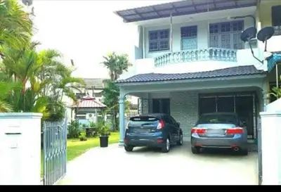 two cars parked in front of a house at Mairahomestay Tambun Islam Only in Tambun