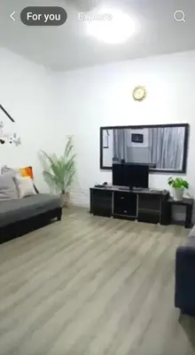 a living room with a bed and a tv at Mairahomestay Tambun Islam Only in Tambun