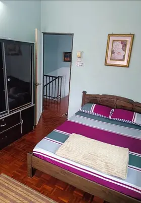 a bedroom with a bed and a flat screen tv at Mairahomestay Tambun Islam Only in Tambun