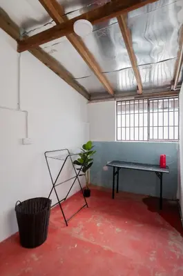 a room with a table and a potted plant at Aayu Chowrasta - 3 mins walk to Penang Road Chendul in George Town